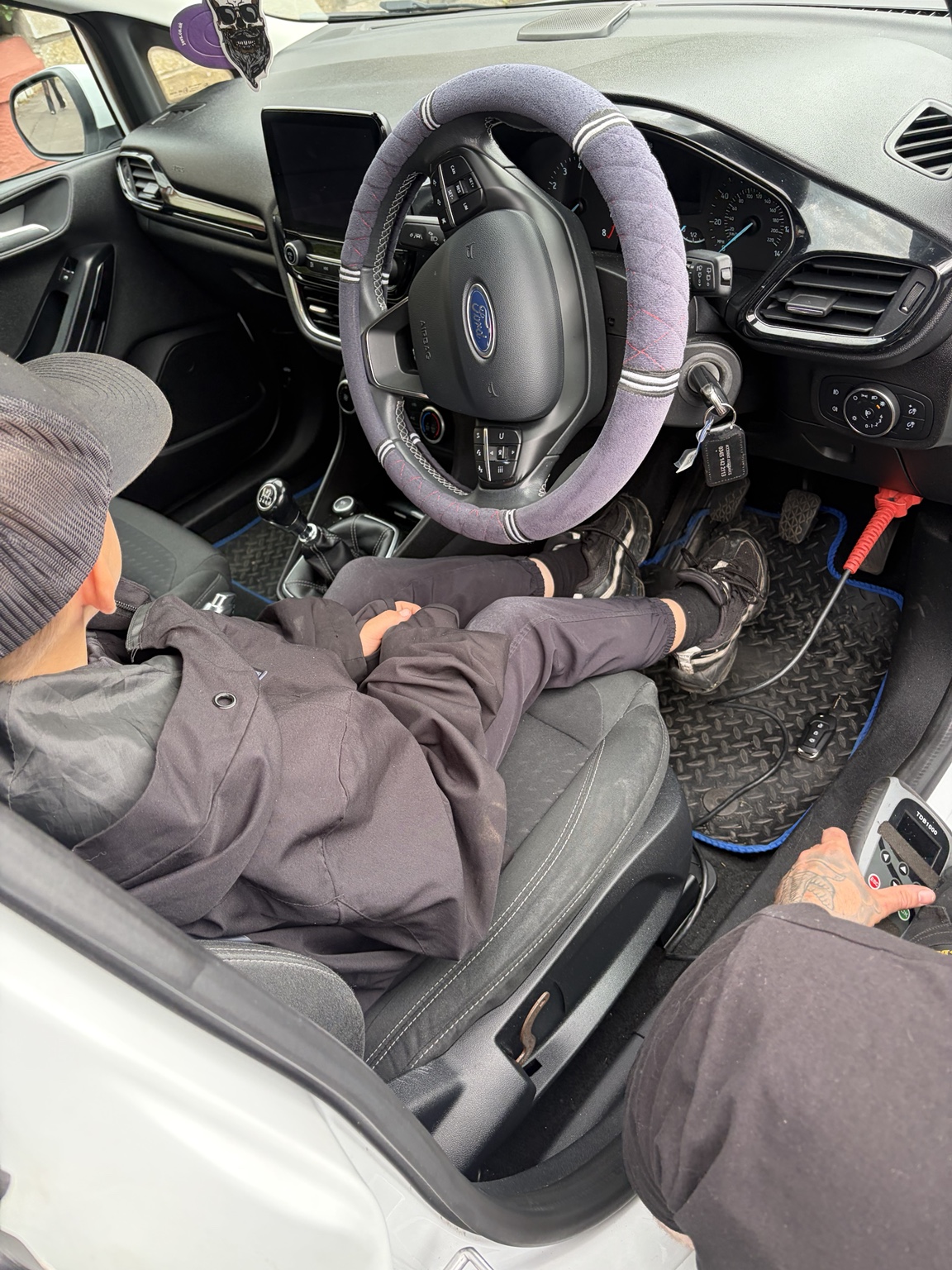 Key in a Ford Fiesta ignition with diagnostic tool connected